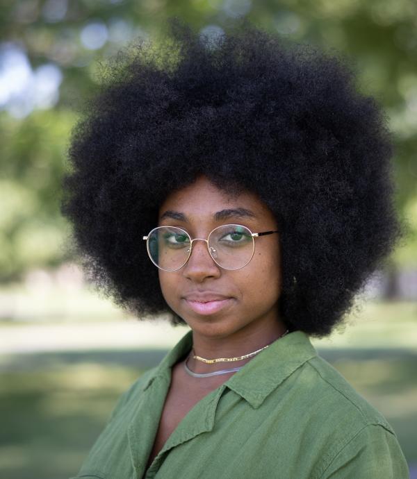 Person wearing glasses and green shirt